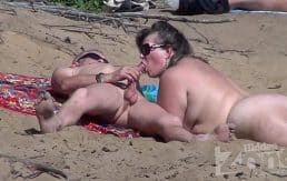 Blowjob on a nudist beach