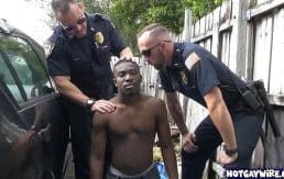 Two police officers take advantages of this black guy